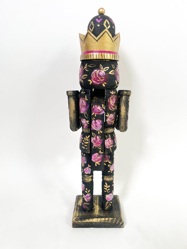 A beautiful addition to your holiday table decor or mantle. The Rose & Noir Nutcracker is a treasure for years to come!