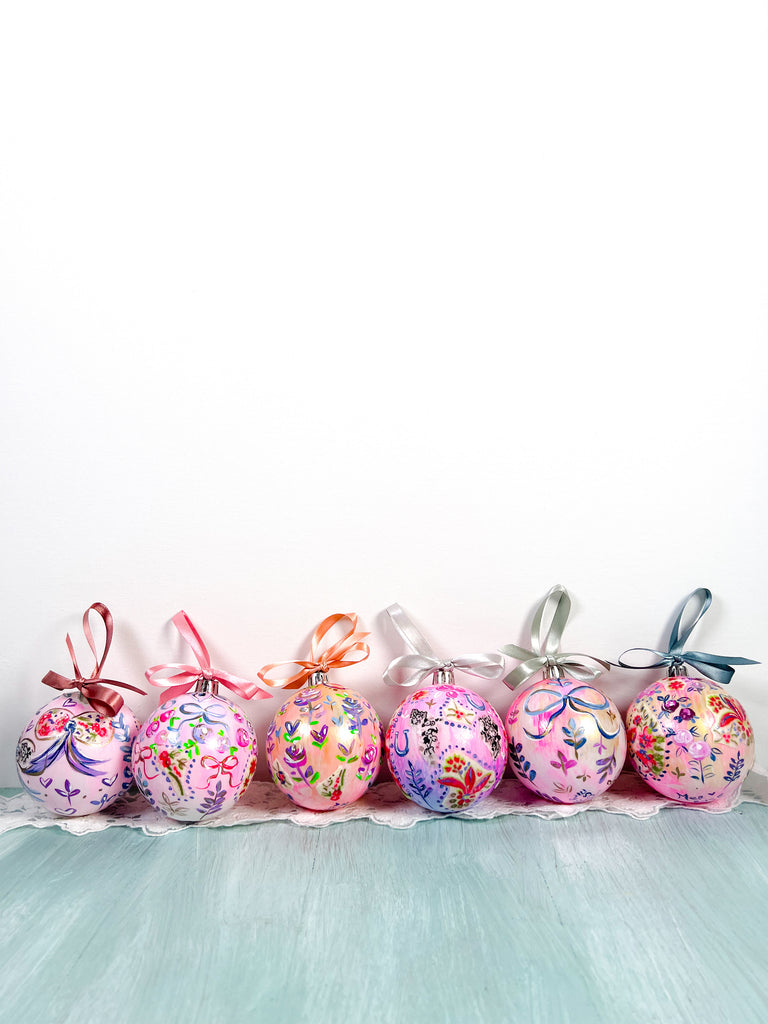 Pretty hand painted, one-of-a-kind holiday Christmas ornaments available to shop on Mer Rose Atelier
