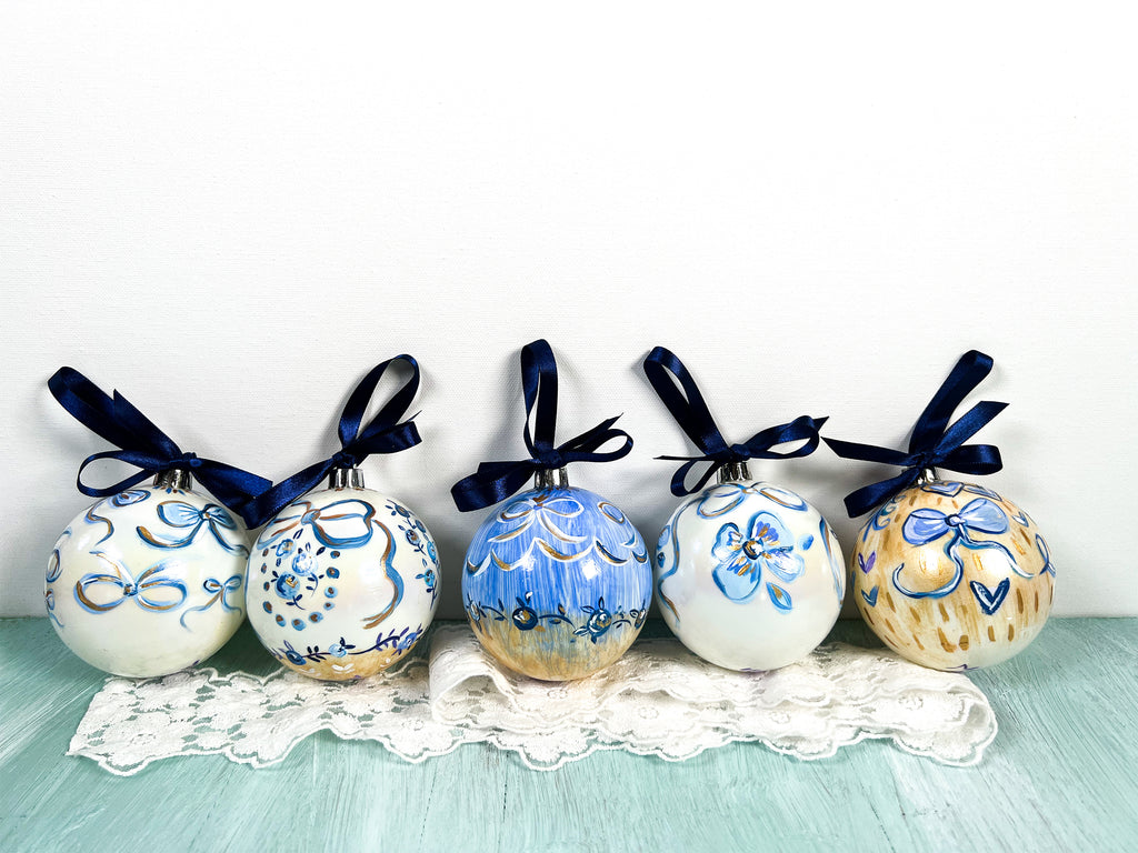 Pretty hand painted, one-of-a-kind holiday Christmas ornaments available to shop on Mer Rose Atelier